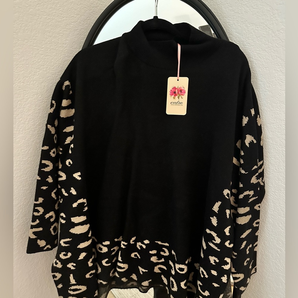 S\M black sweater. New with tags!